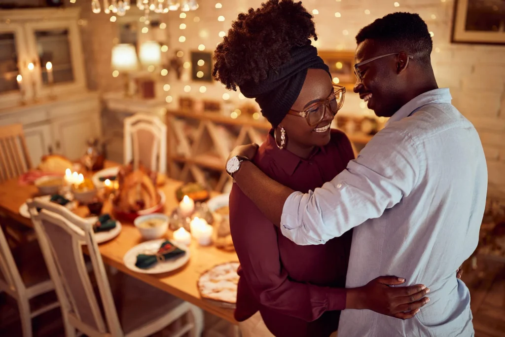Happy Thanksgiving Day wishes shared between a loving couple during a warm and romantic Thanksgiving celebration.