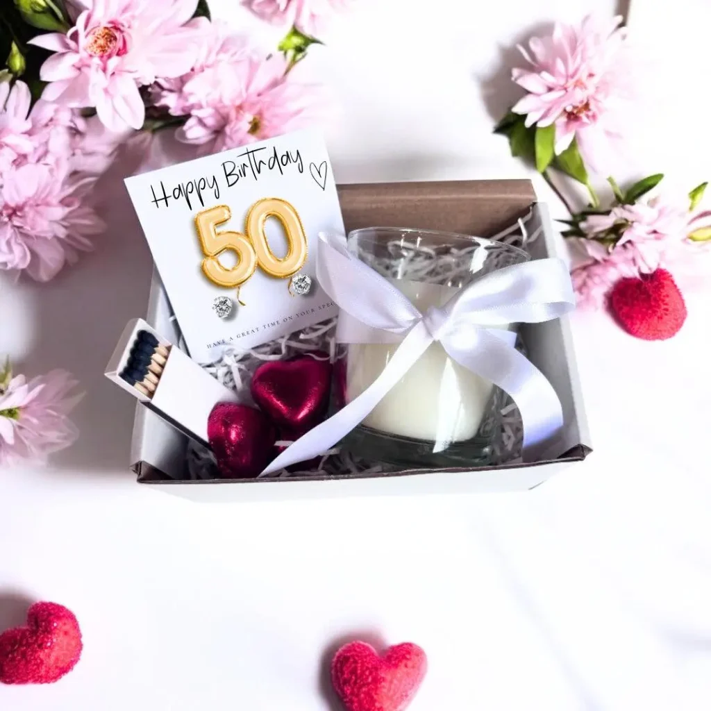 Unique happy 50th birthday wishes with a creative birthday card, flowers, and an elegant gift for a special celebration.