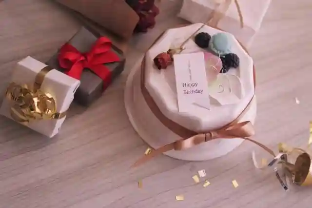 Happy birthday wishes simple text with a unique handwritten birthday message, creative gift box, and decorated cake.