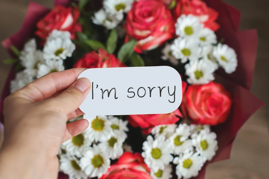 Short and sweet apology message with a red heart and flowers for your love