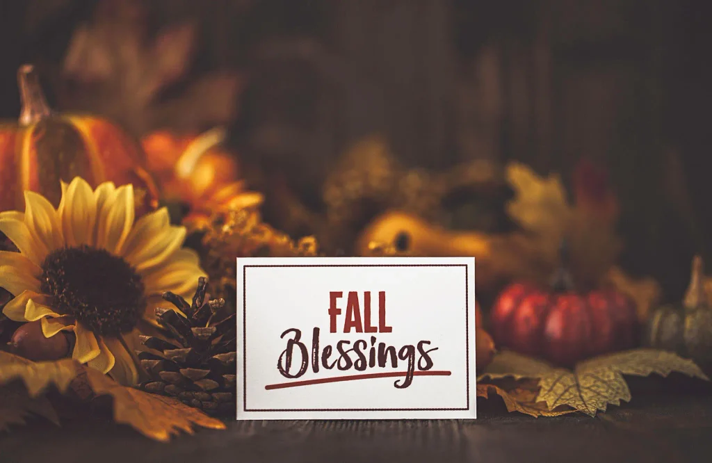 Happy October Blessings shared with friends through a heartfelt greeting card, colorful autumn flowers, and warm coffee.